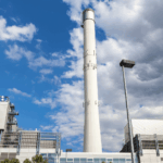 Exterior view of a modern waste-to-energy plant, representing the facilities evaluated by a waste-to-energy expert.