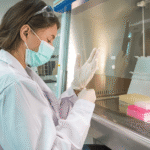 Scientist conducting biological research supported by the NSF Core Research in Biological Sciences funding opportunity.